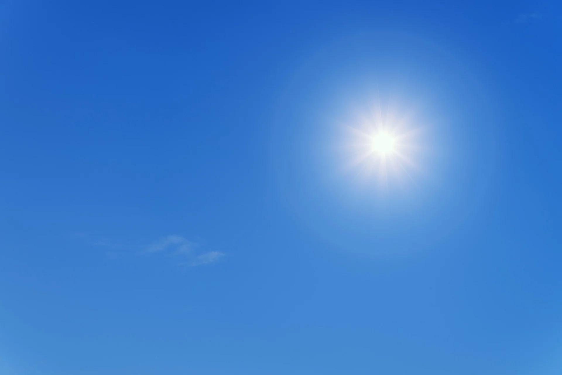 Bright sun in a clear blue sky